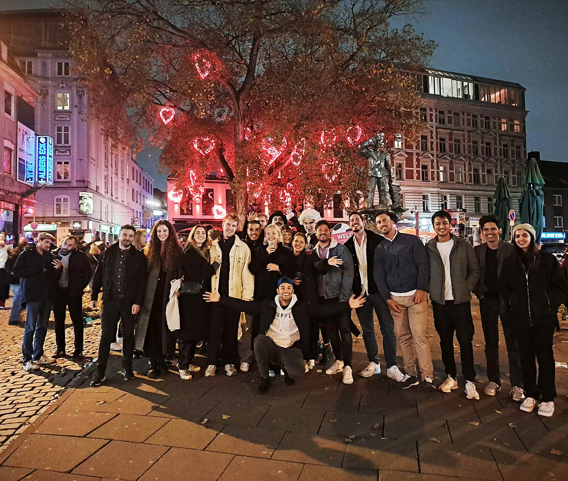 Pubcraql group photo on Berlin street – Bartour Berlin pubcrawl night